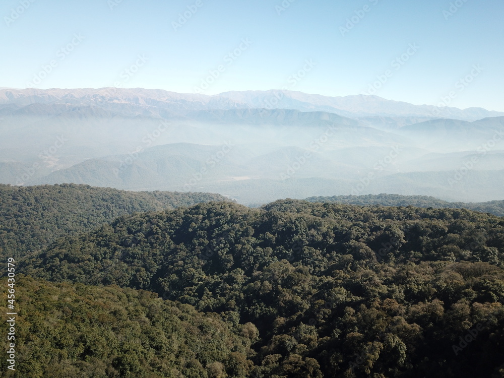 Obraz premium Villa Nougues area in the hills of Tucumán, town, meadow, wooded hills in autumn