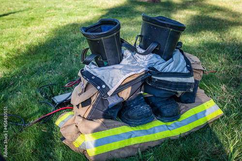Firefighter boots and clothing in a neat stack as part of a 9/11 Sept 11 remembrance service in Auburn, California.