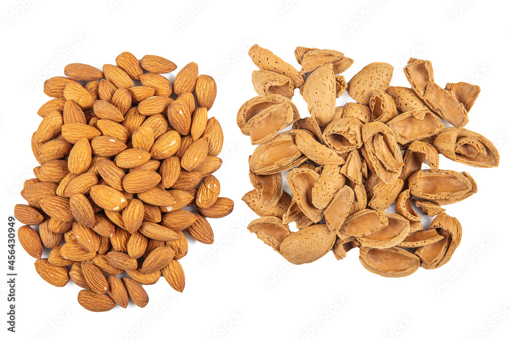 Delicious sweet almonds lie in a large heap, nuts close-up. Fresh nuts, almonds as a background. Delicious sweet almonds lie in a large heap, nuts close-up. Fresh nuts, almonds as a background.