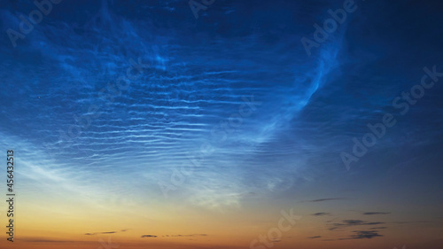 Noctilucent clouds before sunrise, cloudlike atmospheric phenomena visible in twilight. Highest clouds in atmosphere