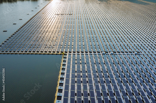 Aerial view of lake in renewable alternative electricity on floating solar panels platform