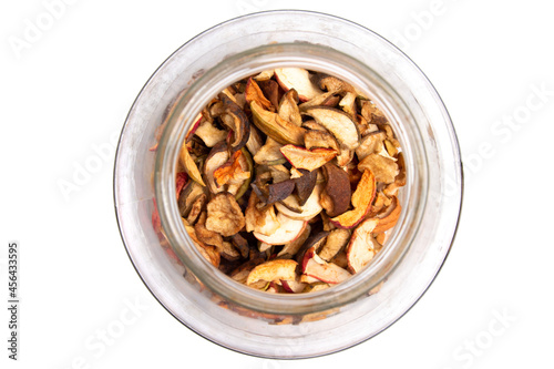 Obraz na płótnie Dried fruits in a glass jar. Dried apples are stored in a glass jar top view. w salonie