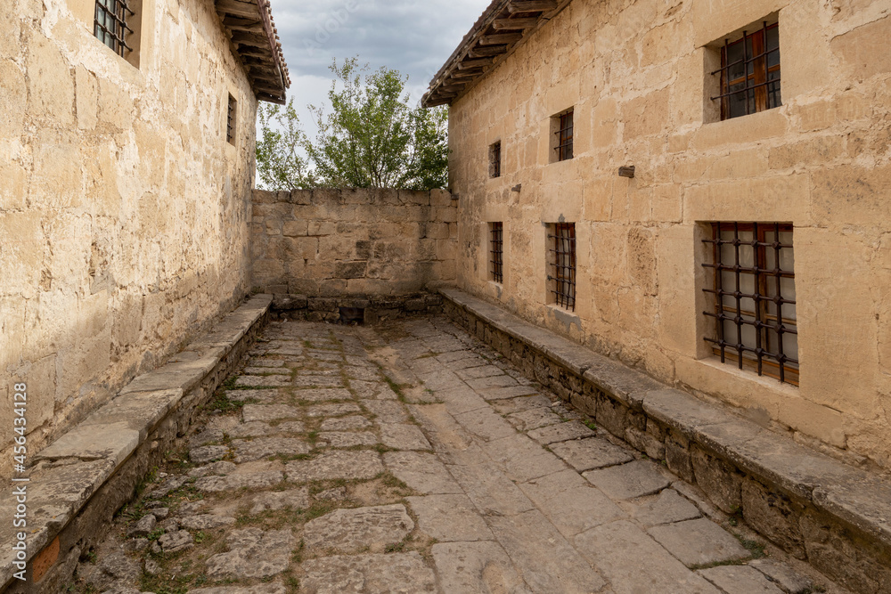 Narrow monastery courtyard paved with stone