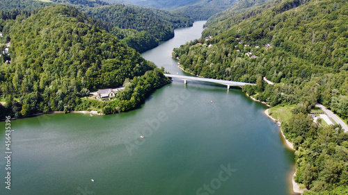 View of the Ruzin reservoir on the outskirts of Kosice. Lake bridge. Boats in the water. River and trees on the mountains. Slovakia. Europe