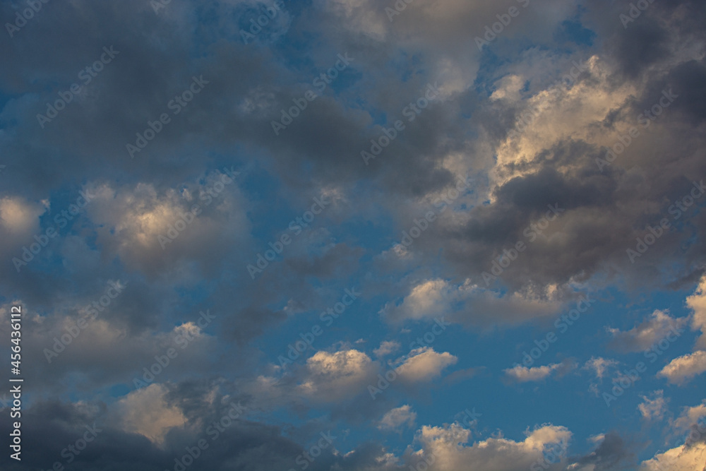 blue sky, dark clouds and sun lights. desktop background.