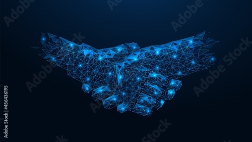 Handshake of a robot and a human. Polygonal construction of interconnected lines and points. Blue background.