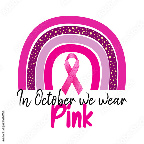 Breast cancer awareness month concept with pink rainbow, pink ribbon and text In October we wear pink