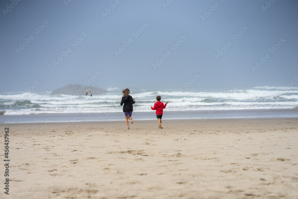 Kids at the beach. Pacific ocean