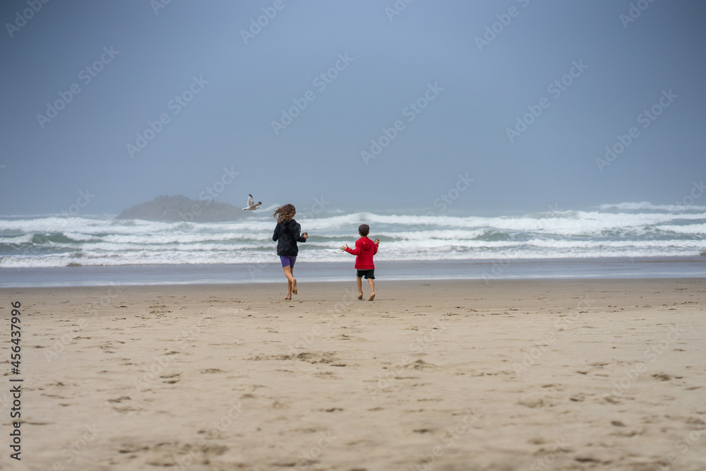 Kids at the beach. Pacific ocean