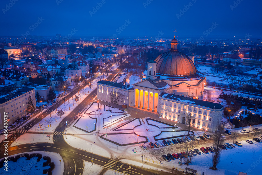 Snowy catholic Basilica in Bydgoszcz at night