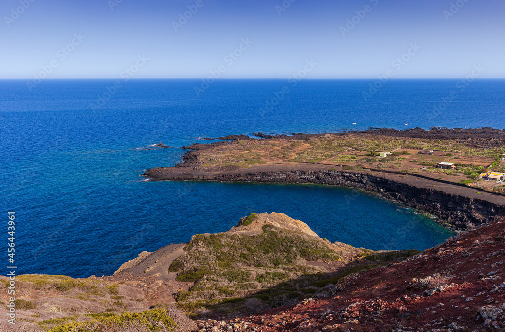 View of the scenic lava rock cliff  in the Linosa island. Sicily