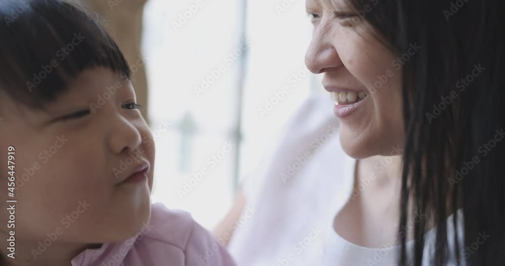 4K Video slow motion Asian mom and little daughter play and kiss each other. Concept of love and connection of mother and kid. 4K Video slow motion Asian mom and little daughter play and kiss each other. Concept of love and connection of mother and kid.