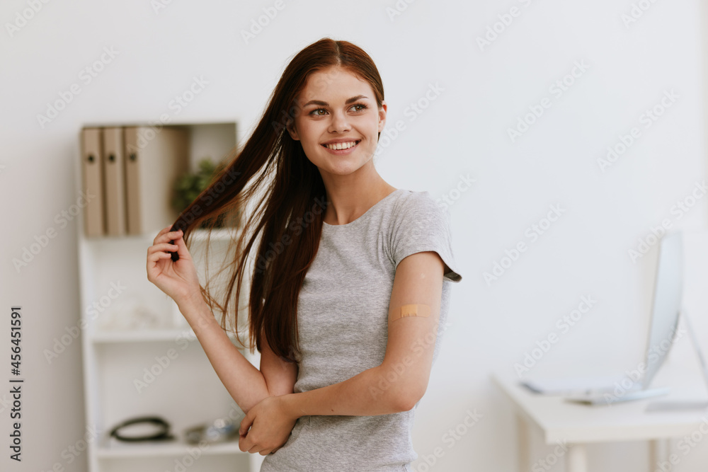 happy woman in hospital covid vaccination passport patient happy woman in hospital covid vaccination passport patient