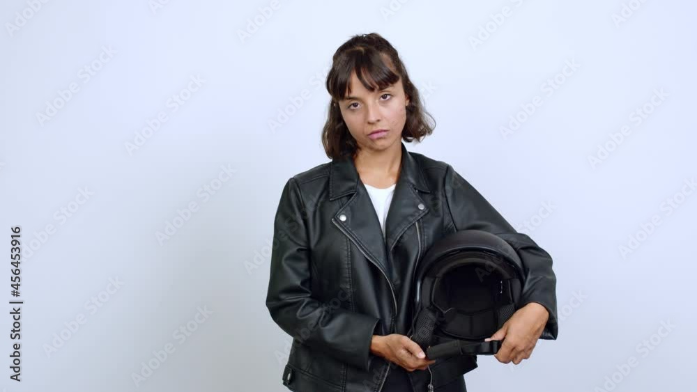 holding a motorcycle helmet . Portratit over isolated background holding a motorcycle helmet . Portratit over isolated background