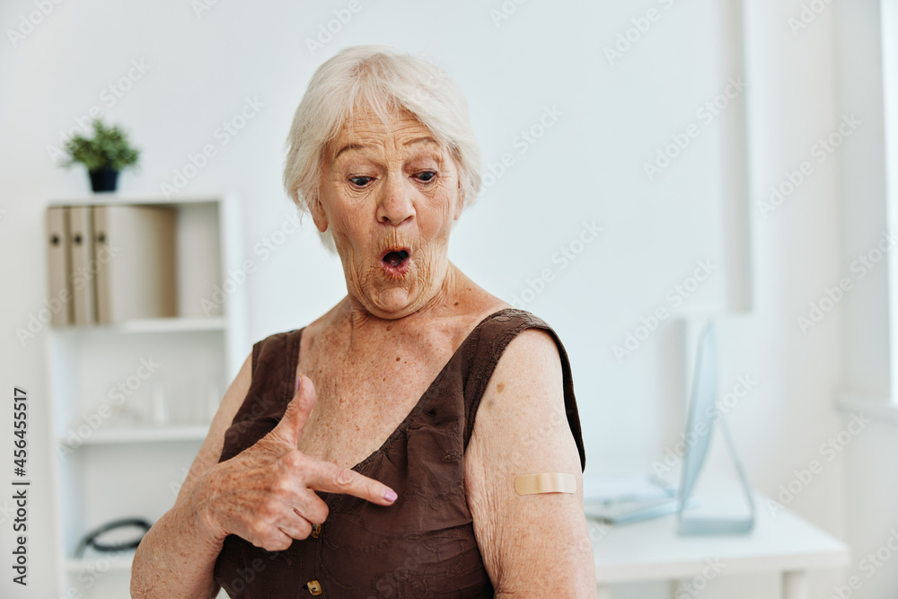 emotional old woman band-aid on shoulder covid passport immunization safety emotional old woman band-aid on shoulder covid passport immunization safety
