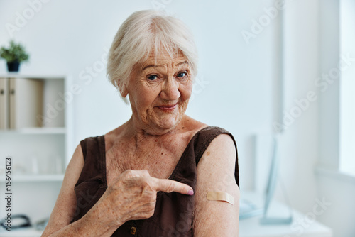 Obraz na plátně emotional old woman hand injection vaccine passport covid-19