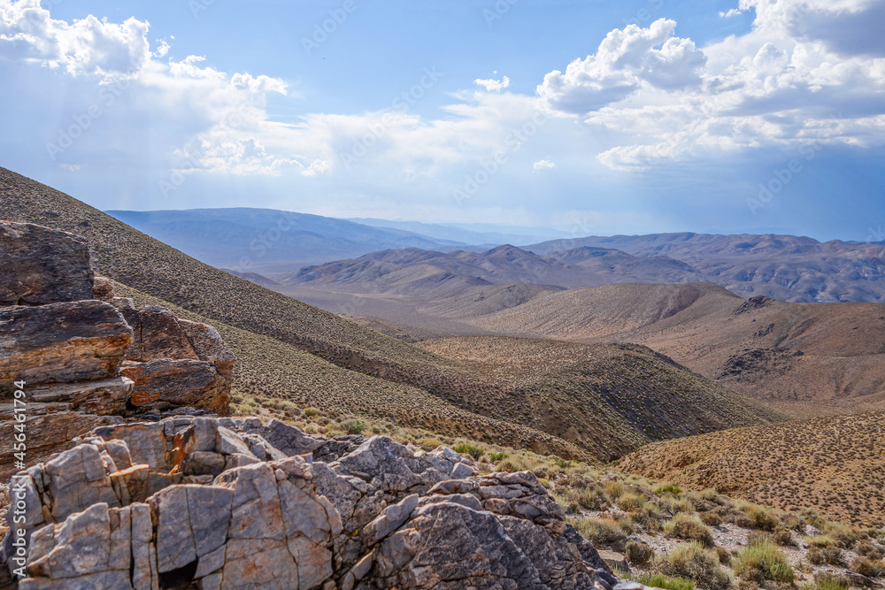 A view looking out over the rolling hills of Death Valley, California on a bright sunny day.