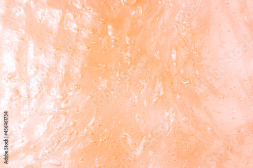 Liquid orange slime background with bubbles and highlights