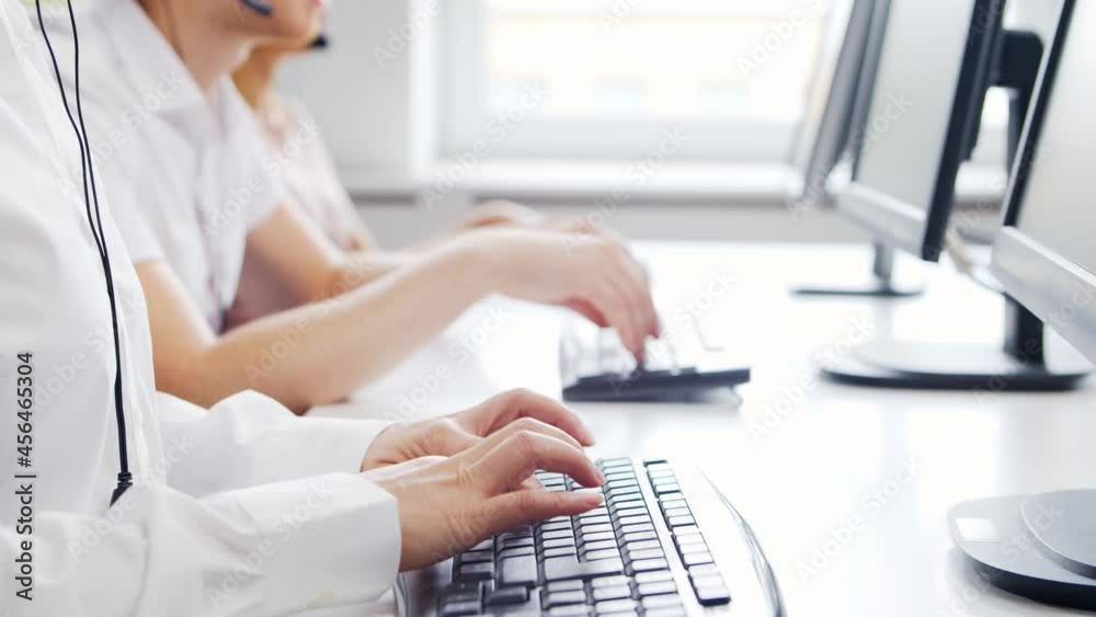 Diverse team of professionals is working in the phone support office. Working day of sales managers in the call center. Concept of business, telephone consulting and problem solving. Diverse team of professionals is working in the phone support office. Working day of sales managers in the call center. Concept of business, telephone consulting and problem solving.