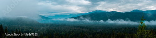 Scenic view from top of a mountain of foggy mountains