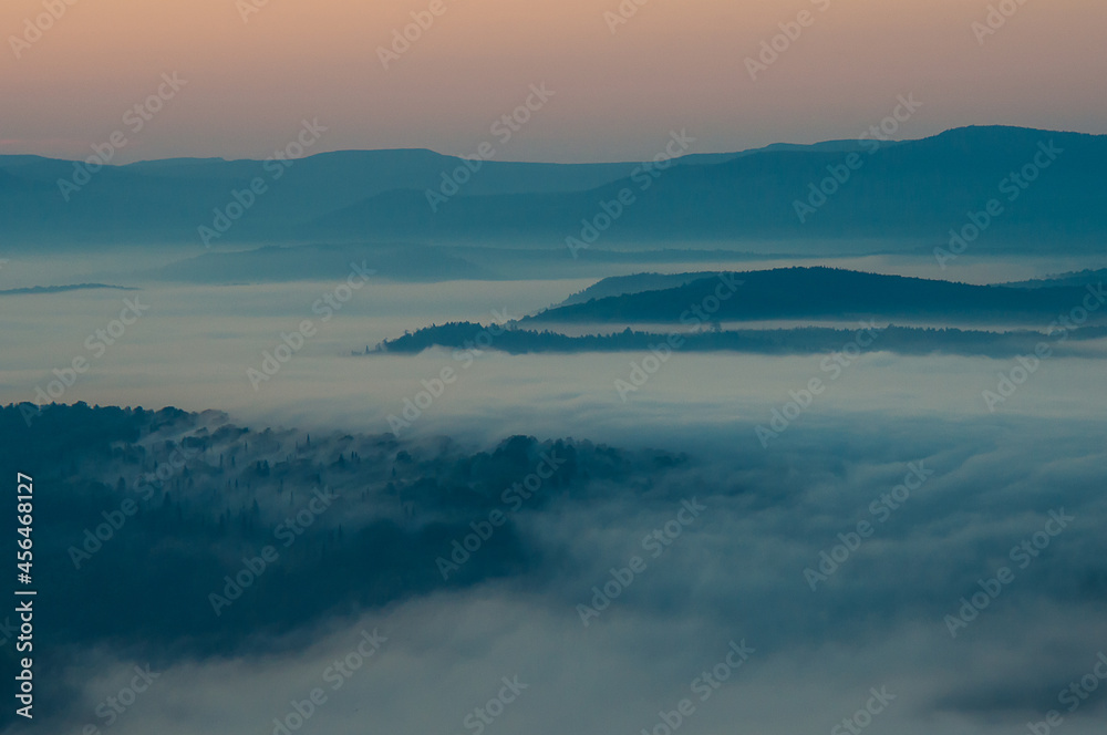 sunrise landscape with fog in the mountains