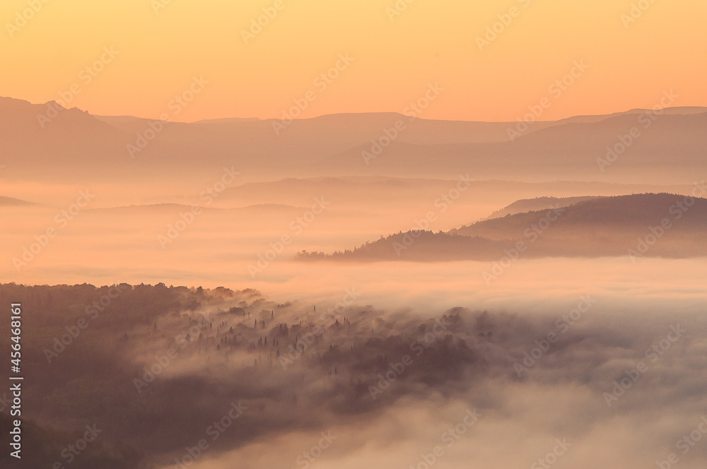 sunrise landscape with fog in the mountains