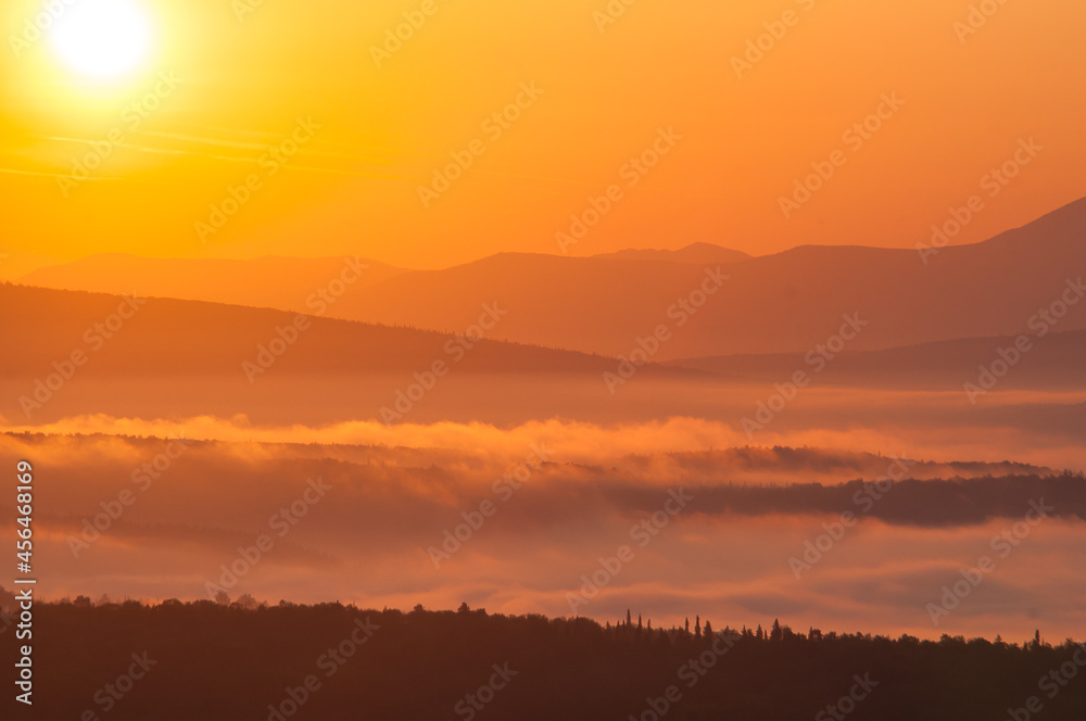 sunrise landscape with fog in the mountains