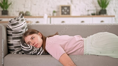 tired caucasian woman falls in the sofa exhausted businesswoman in living room at home