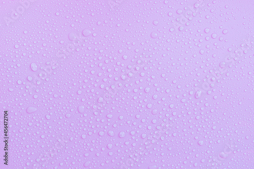 water drops on pastel pink background