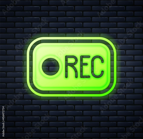 Glowing neon Record button icon isolated on brick wall background. Rec button. Vector