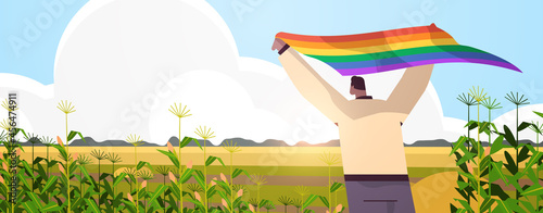 man holding lgbt rainbow flag gay lesbian love parade pride festival transgender love concept