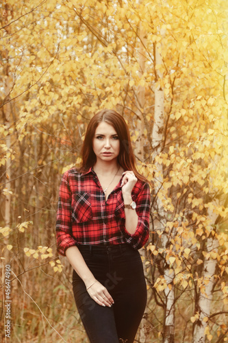 Portrait of cute young woman in casual wear in autumn