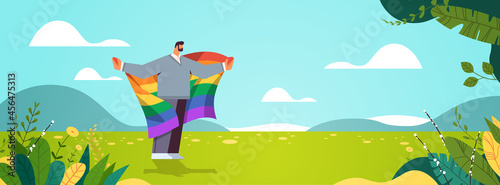 man holding lgbt rainbow flag gay lesbian love parade pride festival transgender love concept