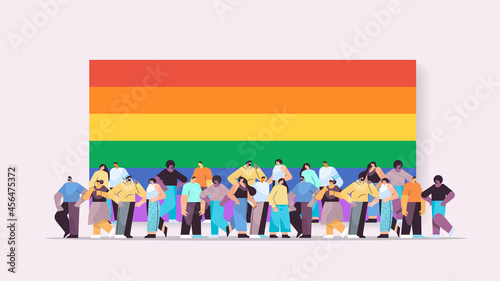 mix race people group standing together near lgbt rainbow flag gay lesbian love parade pride festival transgender love