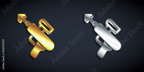 Gold and silver Fishing harpoon icon isolated on black background. Fishery manufacturers for catching fish under water. Diving underwater equipment. Long shadow style. Vector