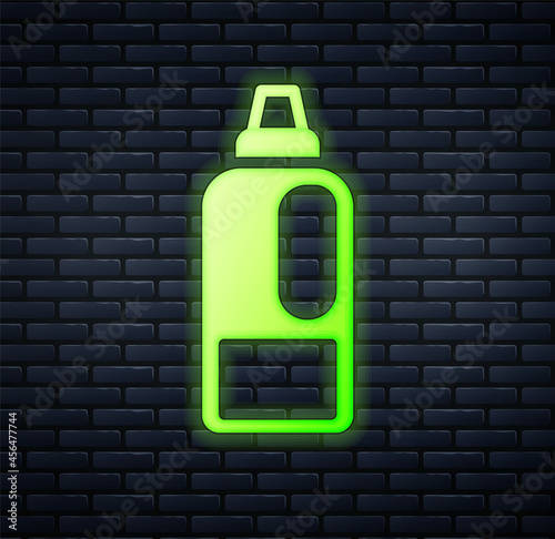 Glowing neon Plastic bottle for laundry detergent, bleach, dishwashing liquid or another cleaning agent icon isolated on brick wall background. Vector