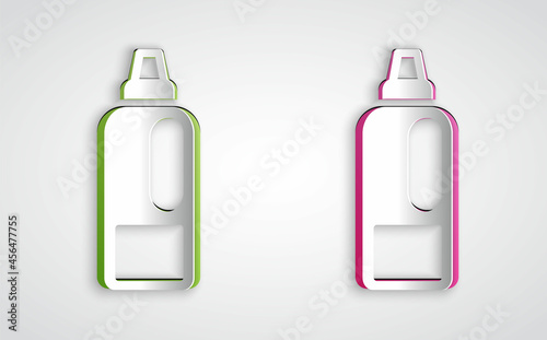 Paper cut Plastic bottle for laundry detergent, bleach, dishwashing liquid or another cleaning agent icon isolated on grey background. Paper art style. Vector