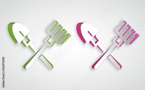 Paper cut Shovel and rake icon isolated on grey background. Tool for horticulture, agriculture, gardening, farming. Ground cultivator. Paper art style. Vector