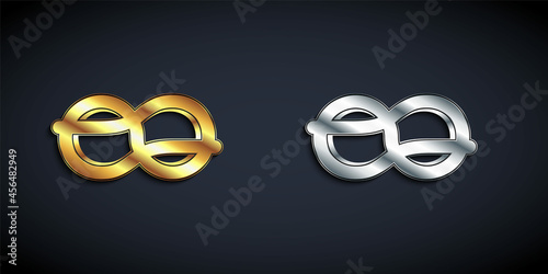 Gold and silver Nautical rope knots icon isolated on black background. Rope tied in a knot. Long shadow style. Vector