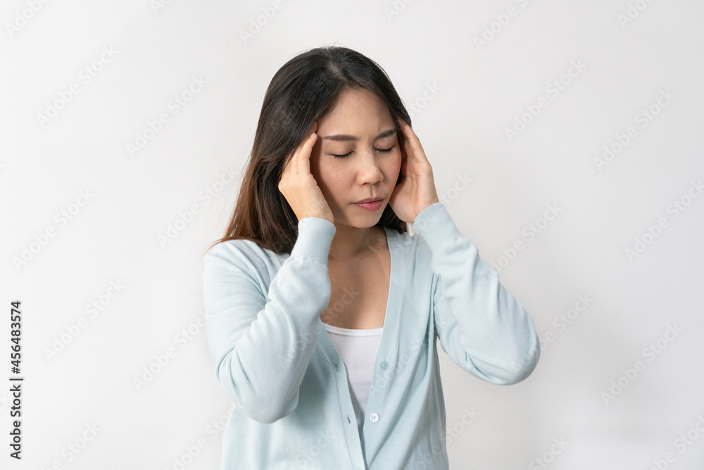 Stressed young Asian woman suffering on depression. Lady suffer from migraine and headache standing over white background. Sad, unhappy, disappointed concept. Close up, copy space Stressed young Asian woman suffering on depression. Lady suffer from migraine and headache standing over white background. Sad, unhappy, disappointed concept. Close up, copy space