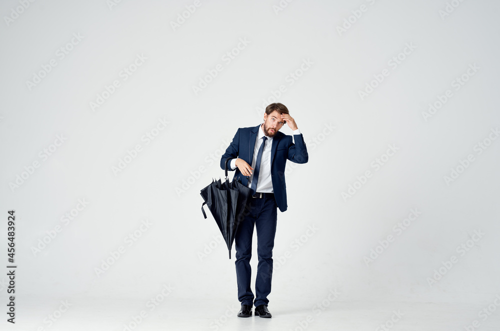 man in suit with umbrella weather protection from rain man in suit with umbrella weather protection from rain