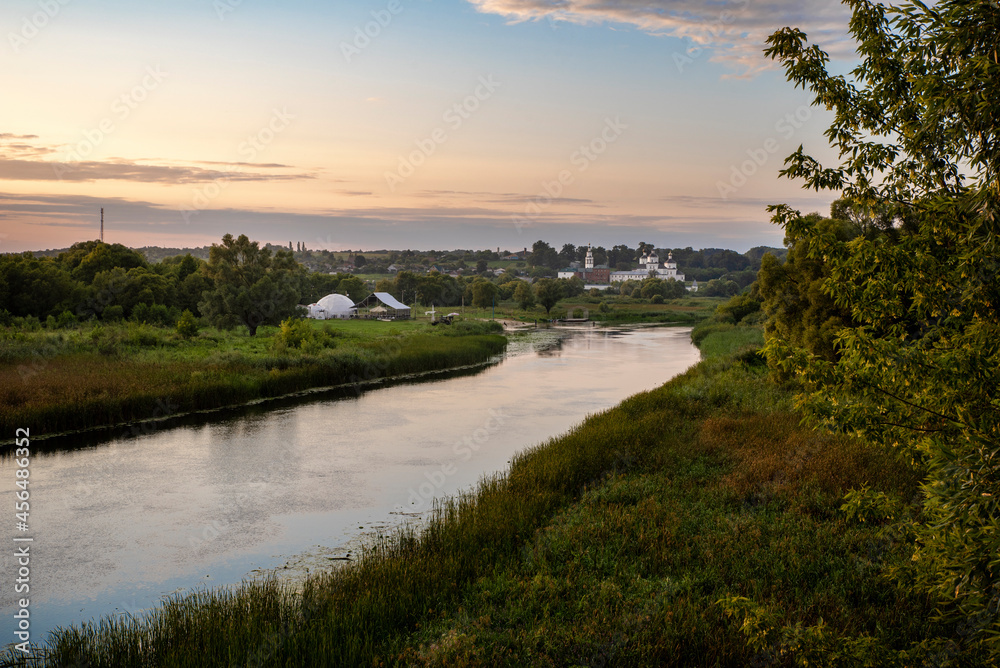 the Seim river at sunset with the Rylsky St. Nicholas Monastery