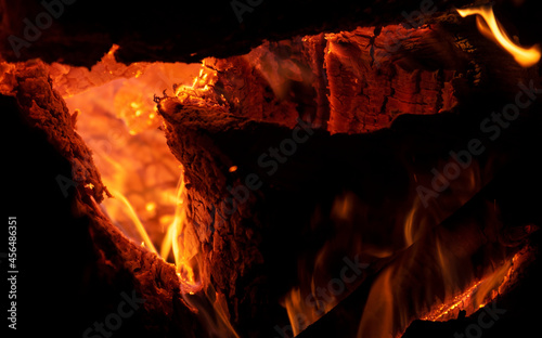 close-up photograph of coals burning in a fire