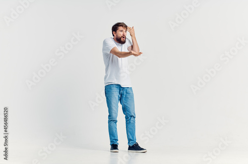 man in white t-shirt movement positive light background