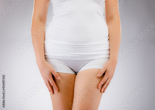 Woman in underwear on gray background