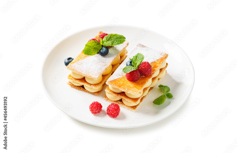 Classic french dessert millefeuille with vanilla cream and fresh berries. isolated on white background Classic french dessert millefeuille with vanilla cream and fresh berries. isolated on white background