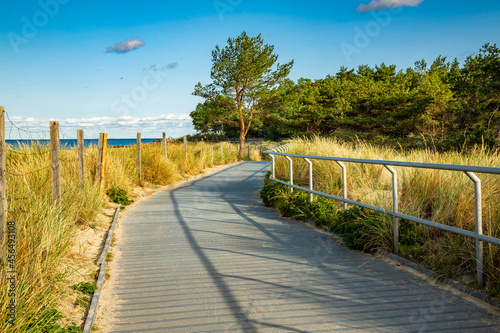 Coastal promenade along beach in Hel town on coast of Baltic Sea, Poland. Hel peninsula is popular place for summer holidays. Hel, Pomerania, Poland © krysek
