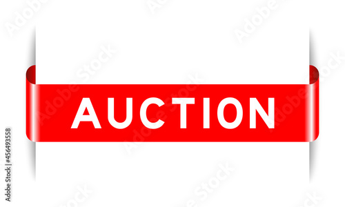 Red color inserted label banner with word auction on white background