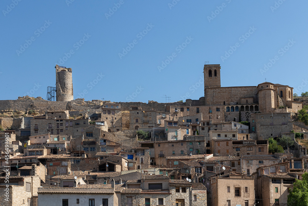 medieval village of guimera in the province of lerida in the north of spain a sunny and hot summer day with the romanic church on the top of the hill