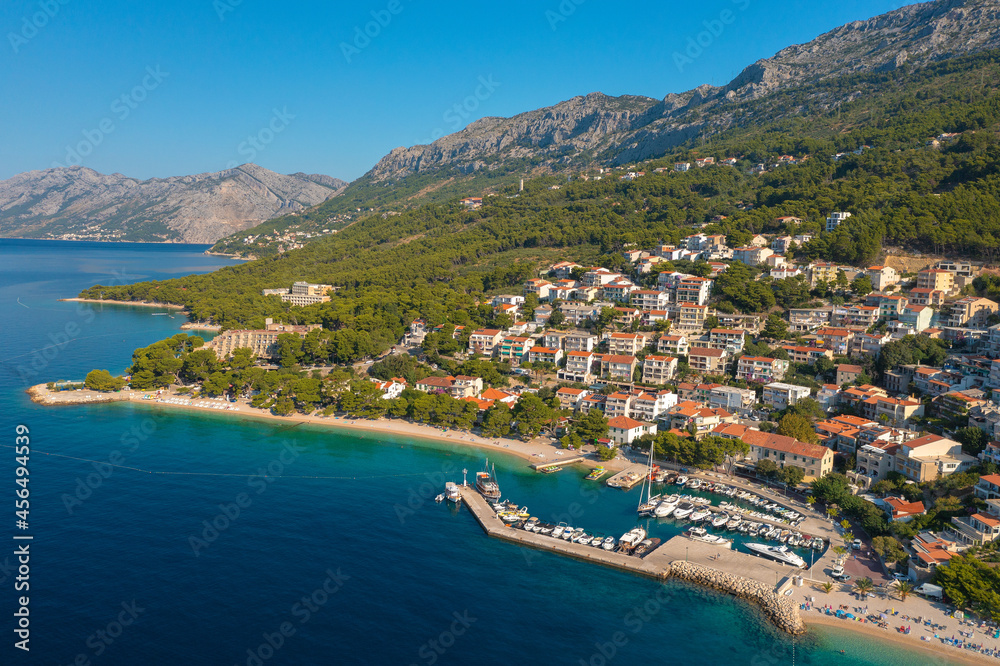 Aerial view of Gradac town below Biokovo mountain, the Adriatic Sea, Croatia